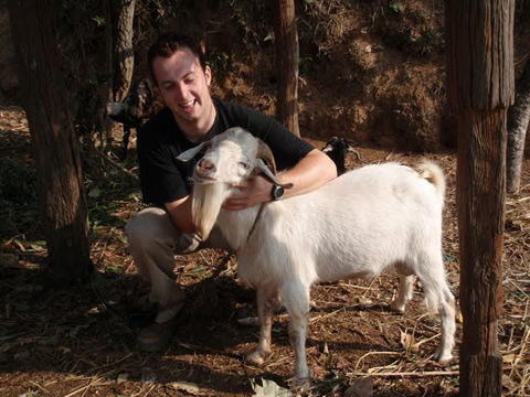 (Ciaran with Billy, a Boer cross buck goat)